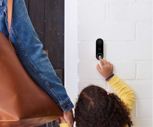 Child with mother ringing a nest doorbell