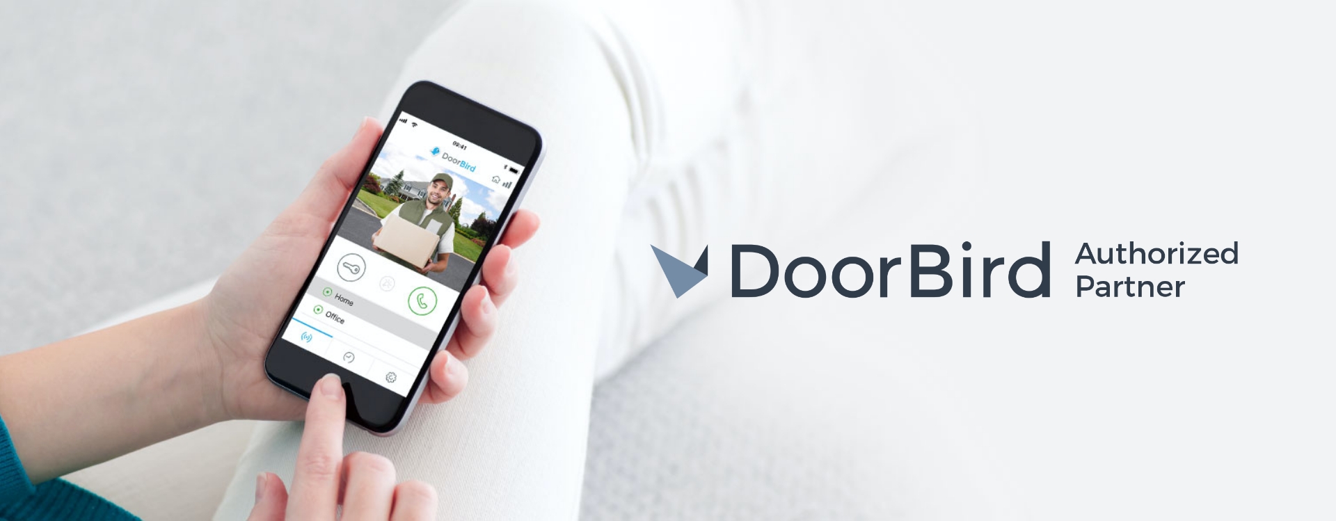 DoorBird banner with a man holding a cellphone