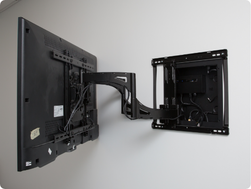 TV mounted on wall with Strong articulating mount