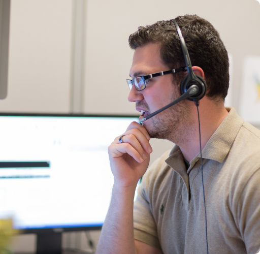 Man with headset on in a customer service role