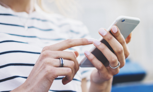 Woman holding a mobile device