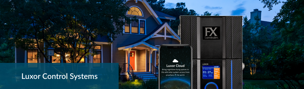 Luxor Controller and app in foregrounds with lit-up house in background and the heading Luxor Control Systems