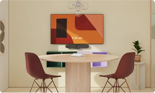 Small meeting room with Logitech camera on wall