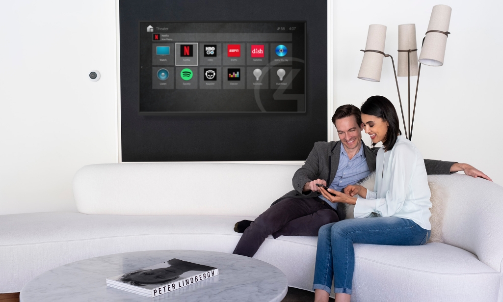 Family on couch with TV in background