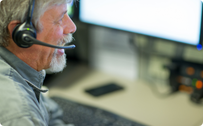 Man on phone in support center