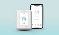 Smart Thermostat with a cellphone showing 74 degrees