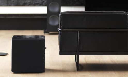 KEF KUBE subwoofer sitting on floor