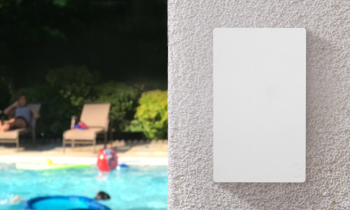 Access Point installed on outdoor wall beside pool