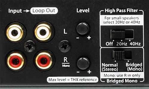 Zoomed-in view of Bridged or Stereo Output switch as as well as left and right gain controls on back of amp