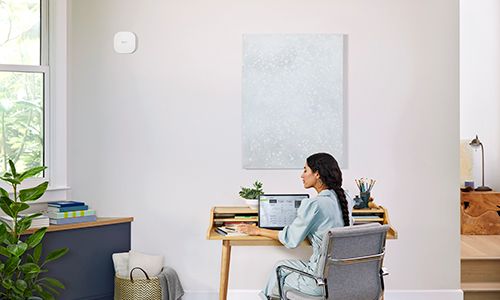 Woman sitting at desk in home office