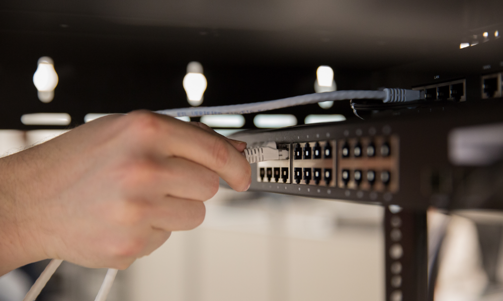 Image of person plugging in wires