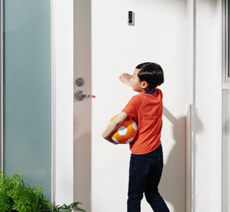 Kid knocking on door with Ring Peep cam installed