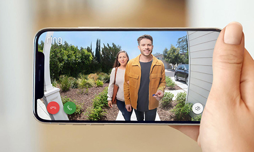 footage of visitors standing outside homeowners door