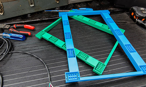 Green and blue brackets lying on ground