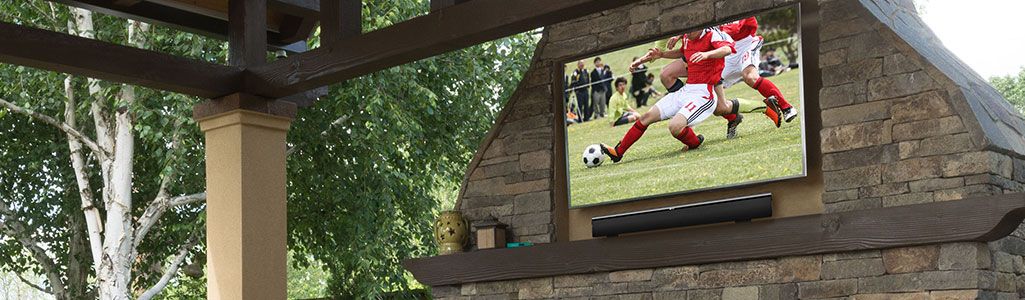 Flatscreen TV and mount installed on an outdoor fireplace