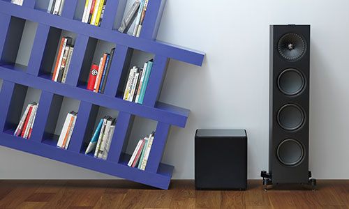 Subwoofer placed beside floorstanding speaker