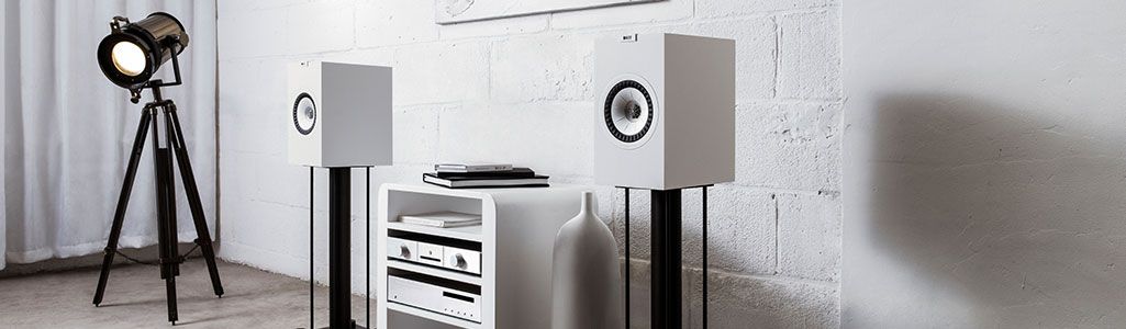 White KEF Q150 Speakers standing in a living room