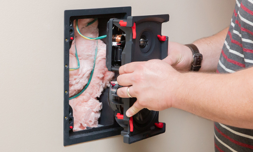 Dealer installing in-wall speaker