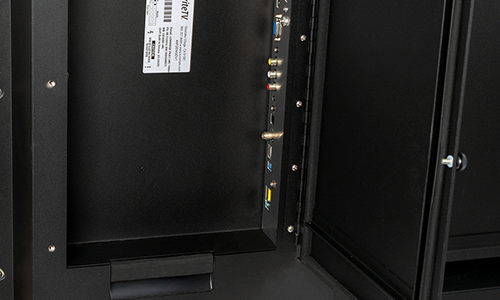 Weatherproof bay door open on TV, revealing port connections