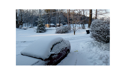 Camera view from front door overlooking a snowy yard