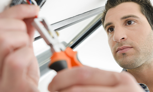 Man installing lighting option with wrench