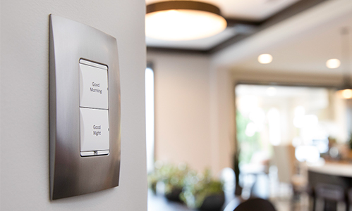 Lighting dimmer on wall with kitchen in background