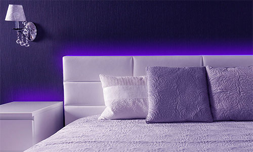 Bedroom with purple lighting
