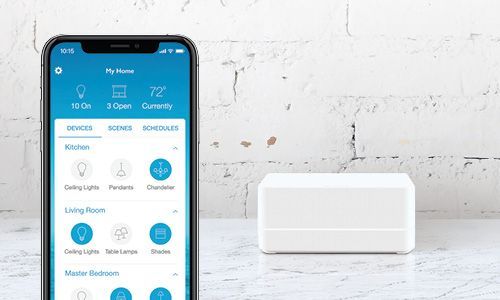 Smartphone displaying Lutron app and Smart Bridge Pro product in background